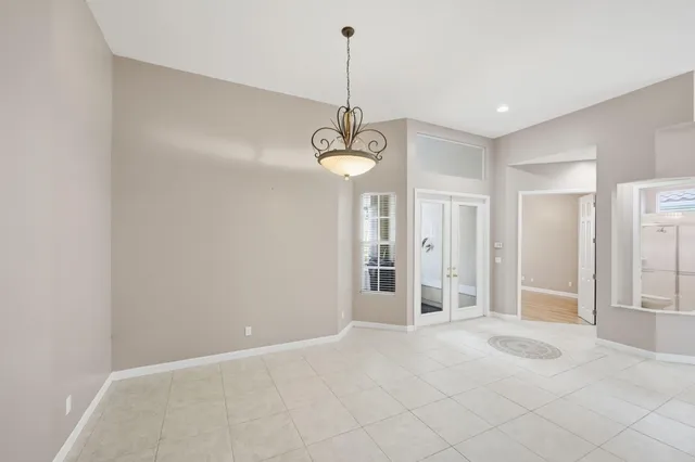 a living room with furniture a rug and a window