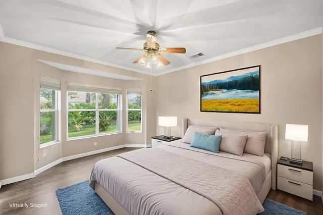a bathroom with a double vanity sink mirror and bathtub