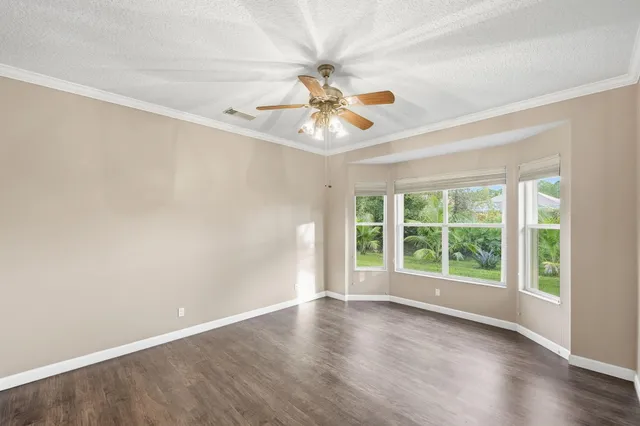 a bathroom with a double vanity sink a mirror and a bathtub