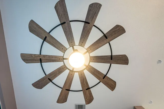 an aerial view of residential houses with yard