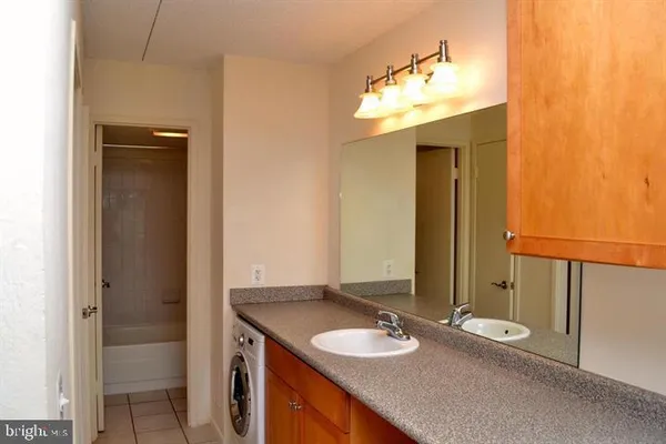 a bathroom with a sink a vanity and a mirror