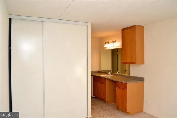 a view of an empty room and a window