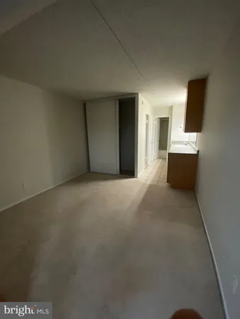 a white bath tub sitting next to a white toilet