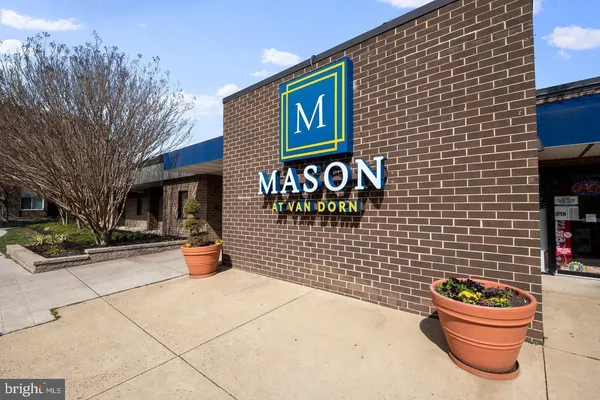 a room with lots of books and a large window