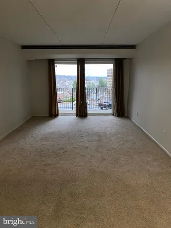 a view of an empty room with a fireplace