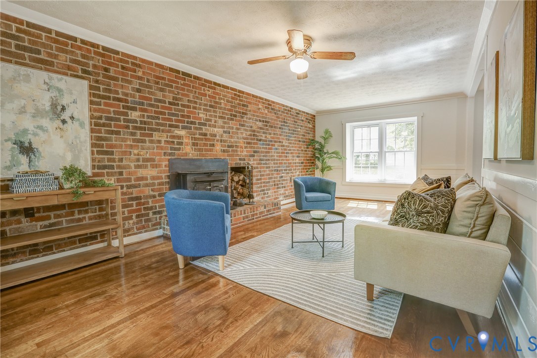 661 Greencastle Road Chesterfield, VA 23236 - Photo 7 of 28 a living room with furniture and a flat screen tv