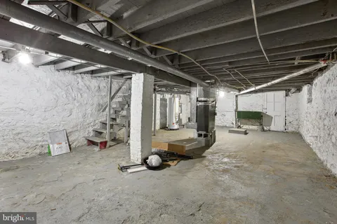 a view of empty room with wooden ceiling