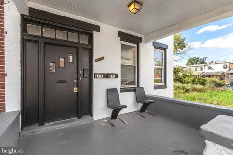 a view of a livingroom with couch and a window