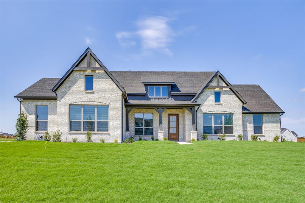 Light-colored brick exterior with dark trim accents
