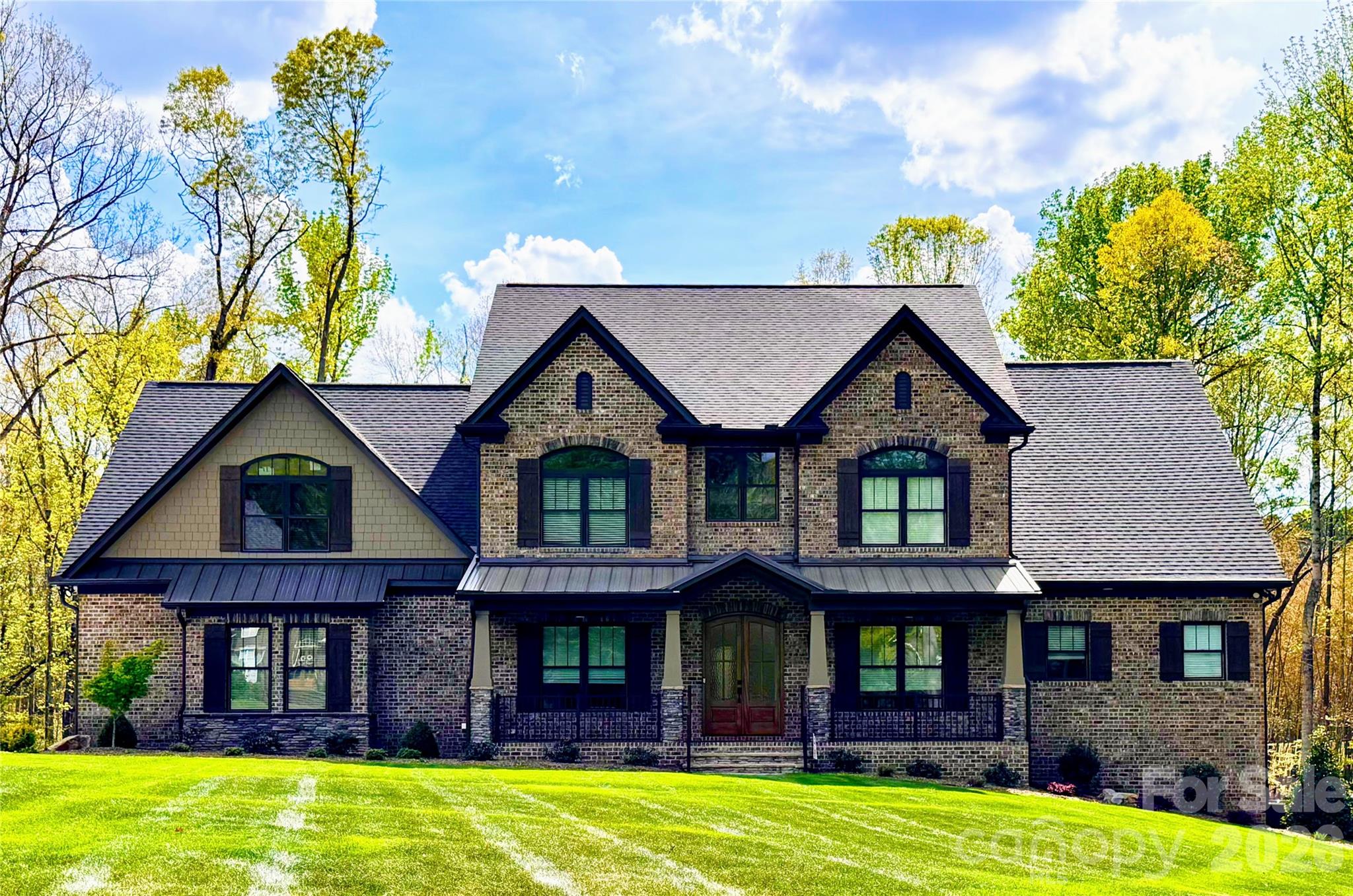 a front view of a house with a yard