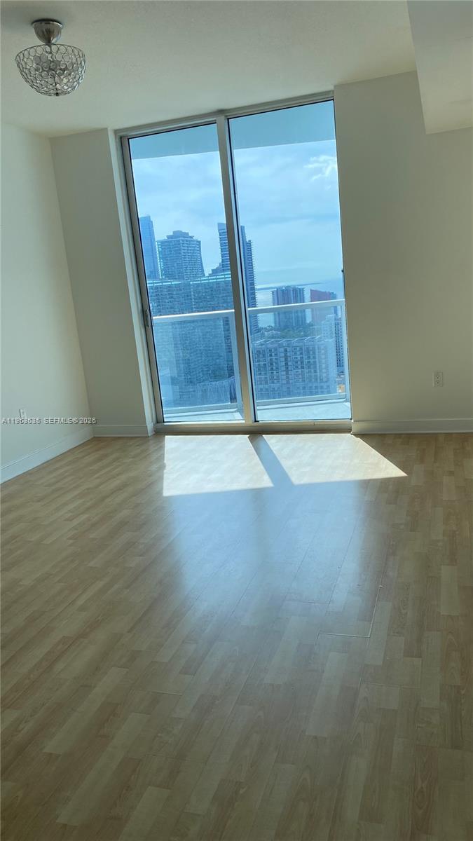 185 Southwest 7th Street, Unit 3706 Miami, FL 33130 - Photo 20 of 26 a view of an empty room with a window