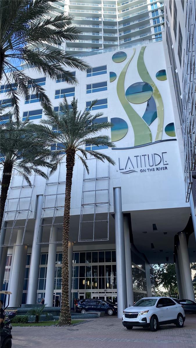 185 Southwest 7th Street, Unit 3706 Miami, FL 33130 - Photo 2 of 26 a view of a building with a door and a window