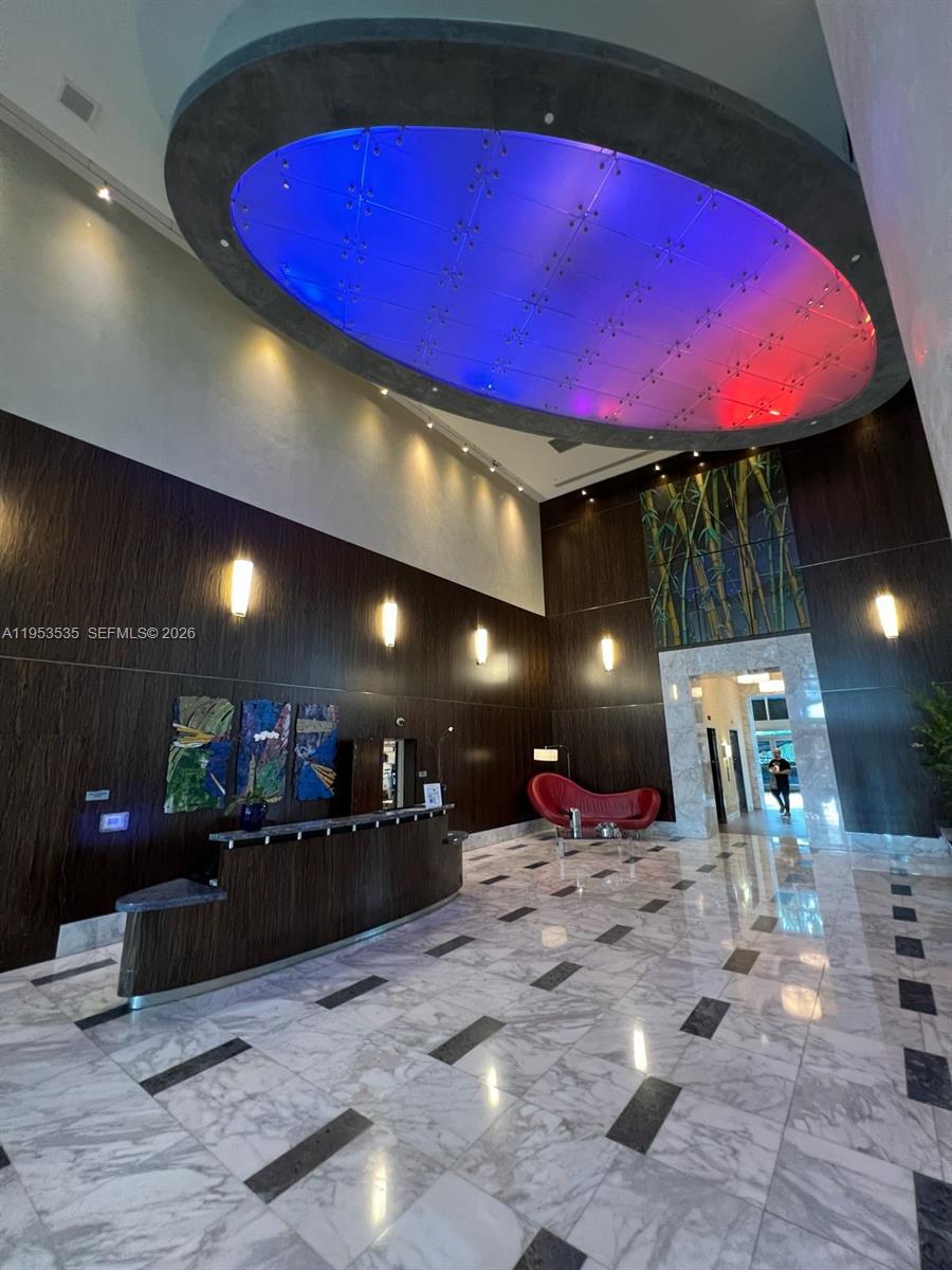 185 Southwest 7th Street, Unit 3706 Miami, FL 33130 - Photo 7 of 26 a view of a lobby with a projector