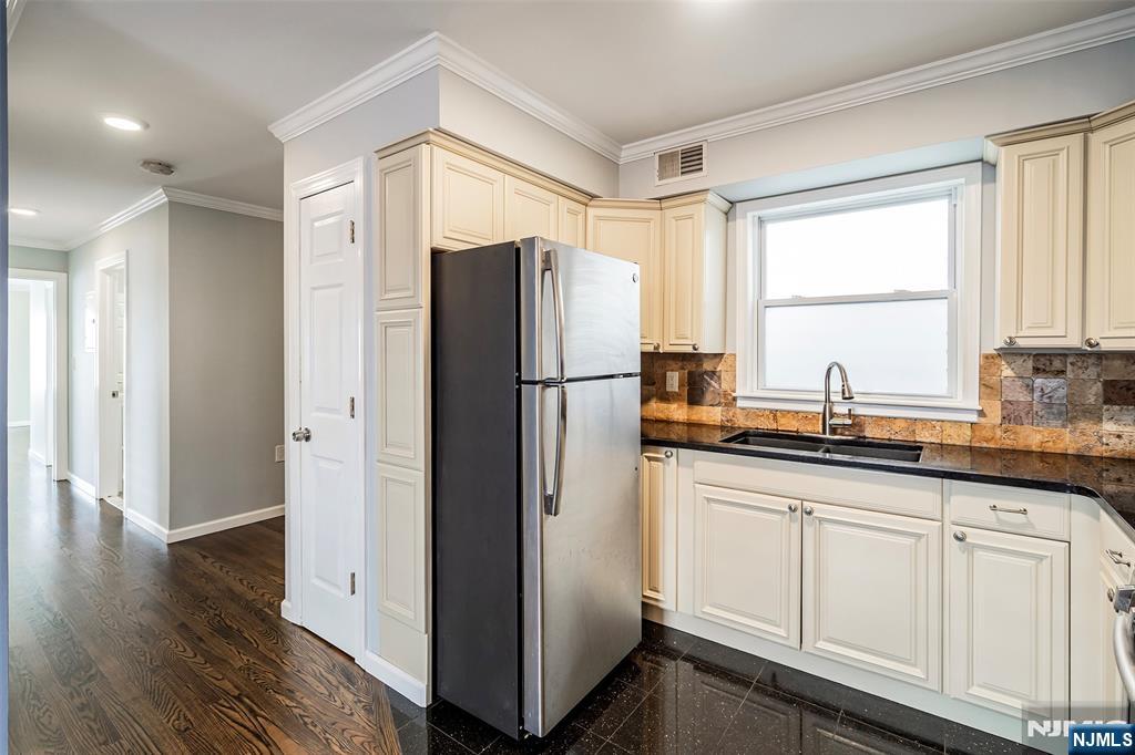 312 Vine Street Elizabeth, NJ 07202 - Photo 3 of 10 a kitchen with stainless steel appliances granite countertop a refrigerator and a sink