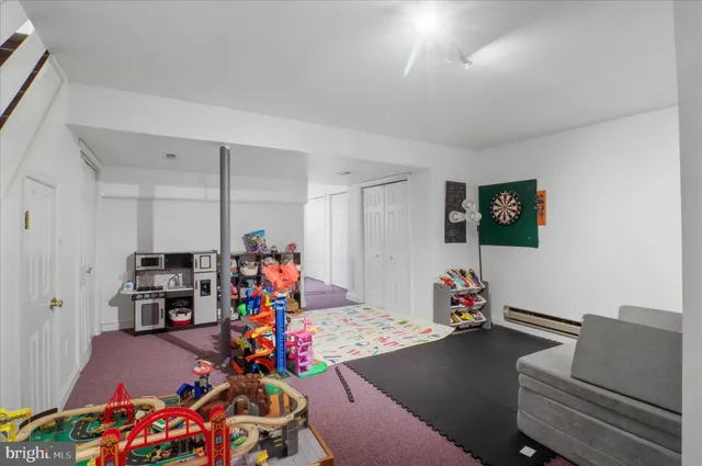 a children room with toys and a couch