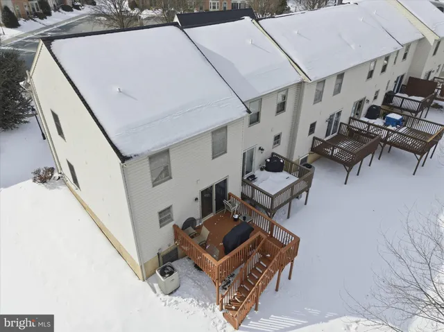 an aerial view of a house with yard and mountain view
