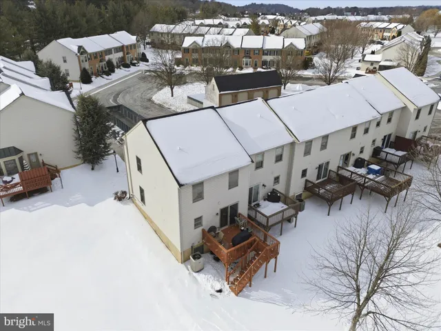 an aerial view of a house with outdoor space