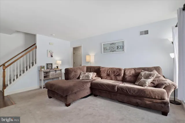 a living room with furniture and a couch