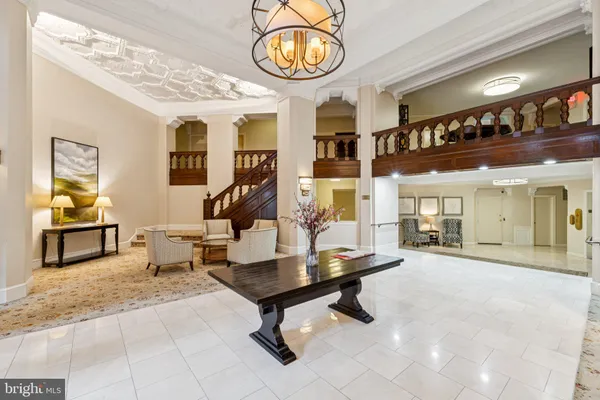 a view of a lobby with furniture and chandelier