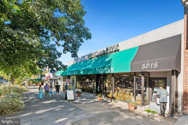 a front view of a building with retail shops