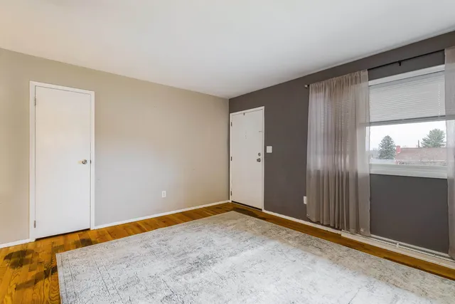 a kitchen with granite countertop a refrigerator stove top oven and sink