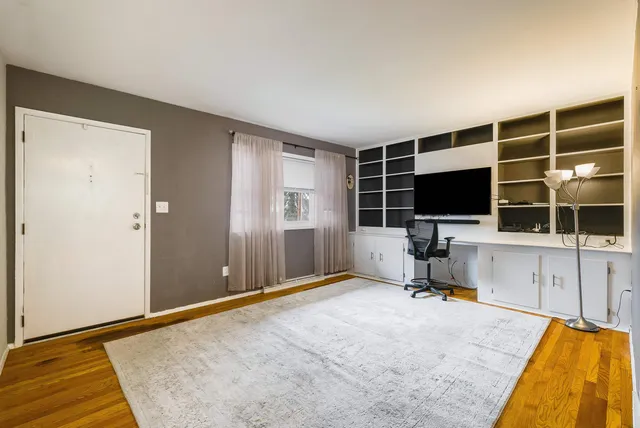 a view of a workspace with furniture