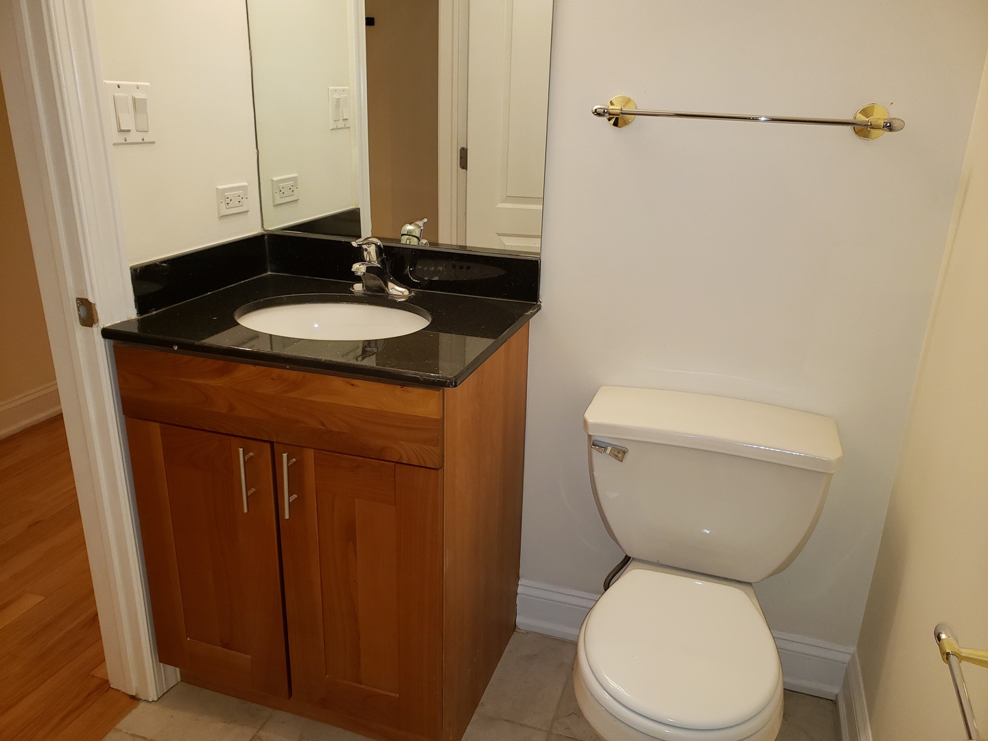 27 East 26th Street, Unit 3 Chicago, IL 60616 - Photo 14 of 17 a white toilet sitting next to a bathroom sink