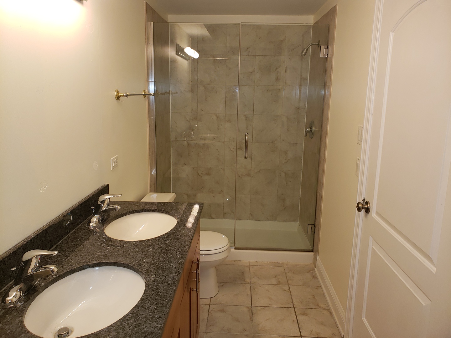 27 East 26th Street, Unit 3 Chicago, IL 60616 - Photo 9 of 17 a bathroom with a sink a toilet and shower
