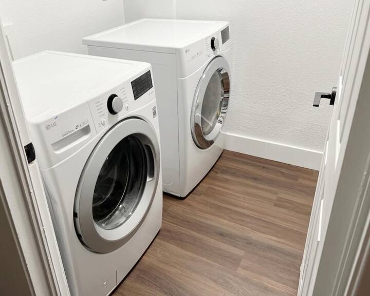 5700 Signal Point Austin, TX 78724 - Photo 15 of 16 Washroom featuring independent washer and dryer and wood finished floors