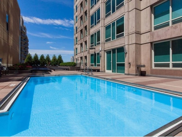 33 West Ontario Street, Unit 36G Chicago, IL 60654 - Photo 11 of 13 a swimming pool with outdoor seating and yard