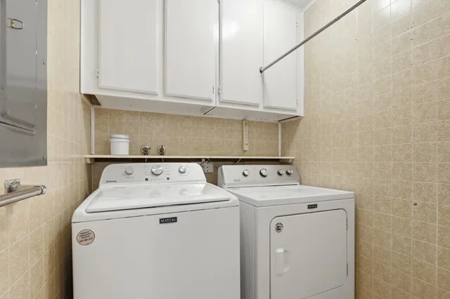 a utility room with dryer and washer