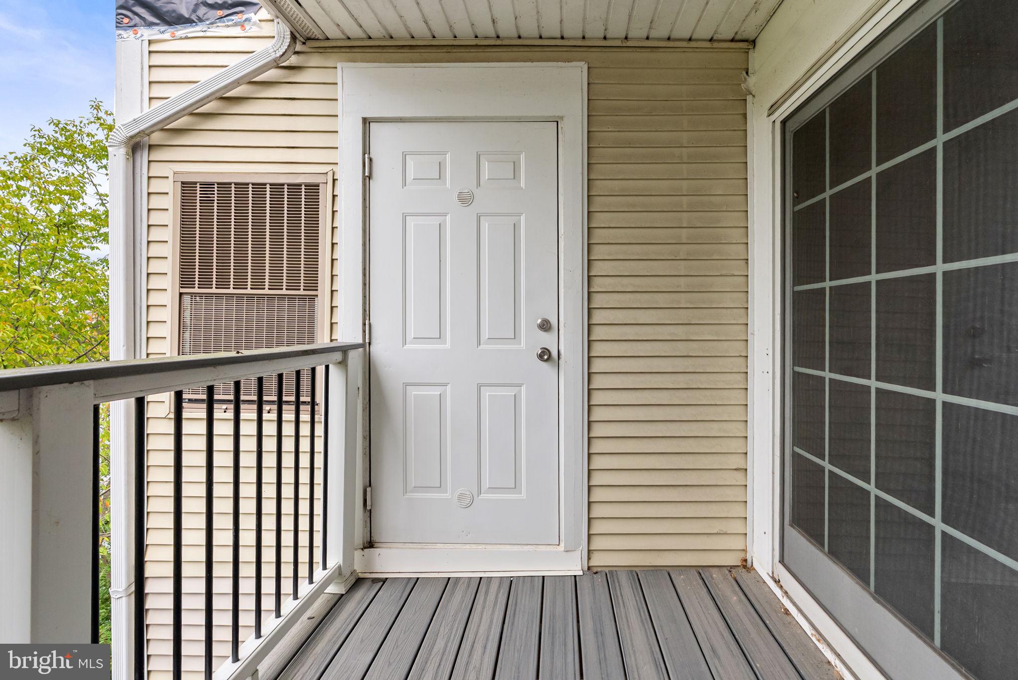 44084 Natalie Terrace, Unit 301 Ashburn, VA 20147 - Photo 18 of 59 a view of wooden balcony
