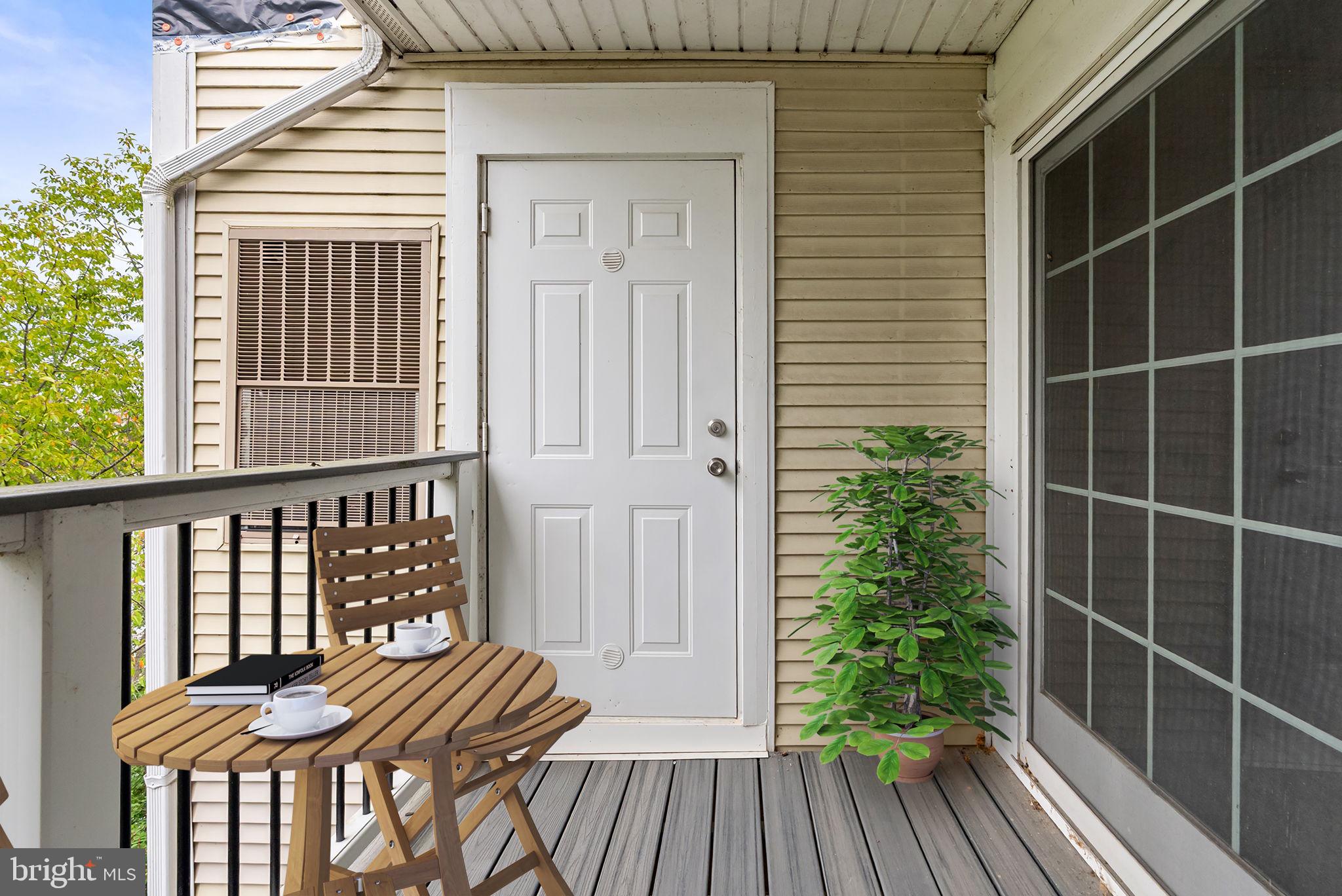 44084 Natalie Terrace, Unit 301 Ashburn, VA 20147 - Photo 19 of 59 a view of a balcony with furniture