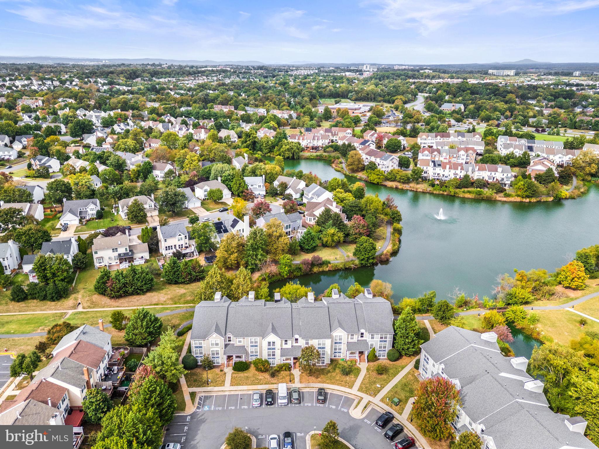 44084 Natalie Terrace, Unit 301 Ashburn, VA 20147 - Photo 3 of 59 an aerial view of residential houses with outdoor space
