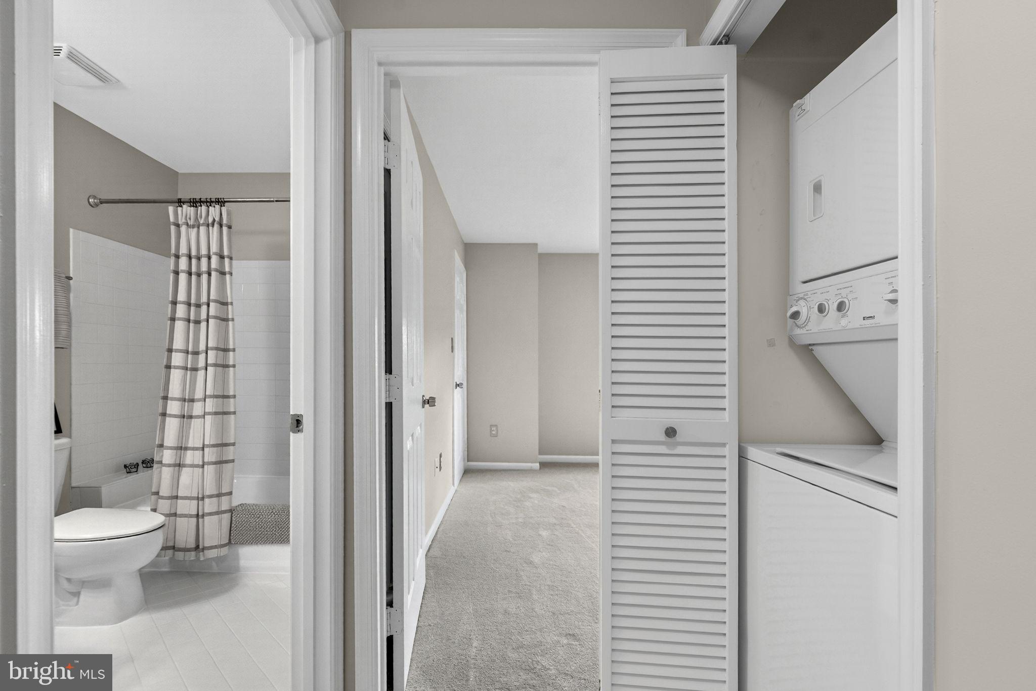 44084 Natalie Terrace, Unit 301 Ashburn, VA 20147 - Photo 40 of 59 a bathroom with a toilet sink and shower