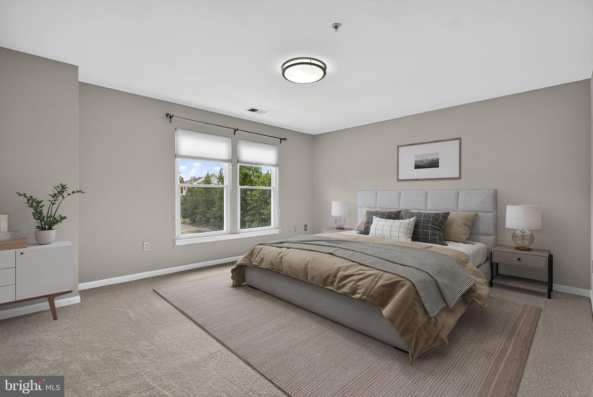 44084 Natalie Terrace, Unit 301 Ashburn, VA 20147 - Photo 46 of 59 a bedroom with a bed and a window