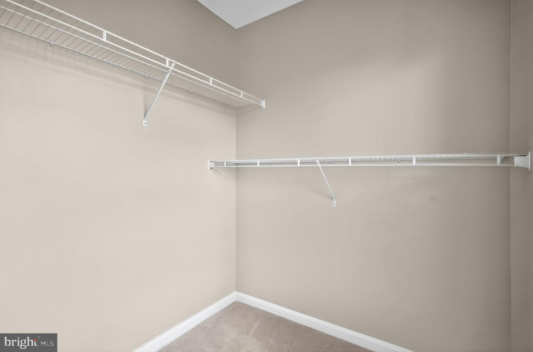 44084 Natalie Terrace, Unit 301 Ashburn, VA 20147 - Photo 49 of 59 a view of a room with racks on the wall