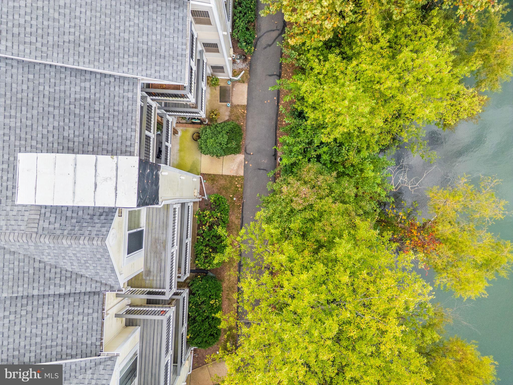 44084 Natalie Terrace, Unit 301 Ashburn, VA 20147 - Photo 50 of 59 front view of a house with a tree