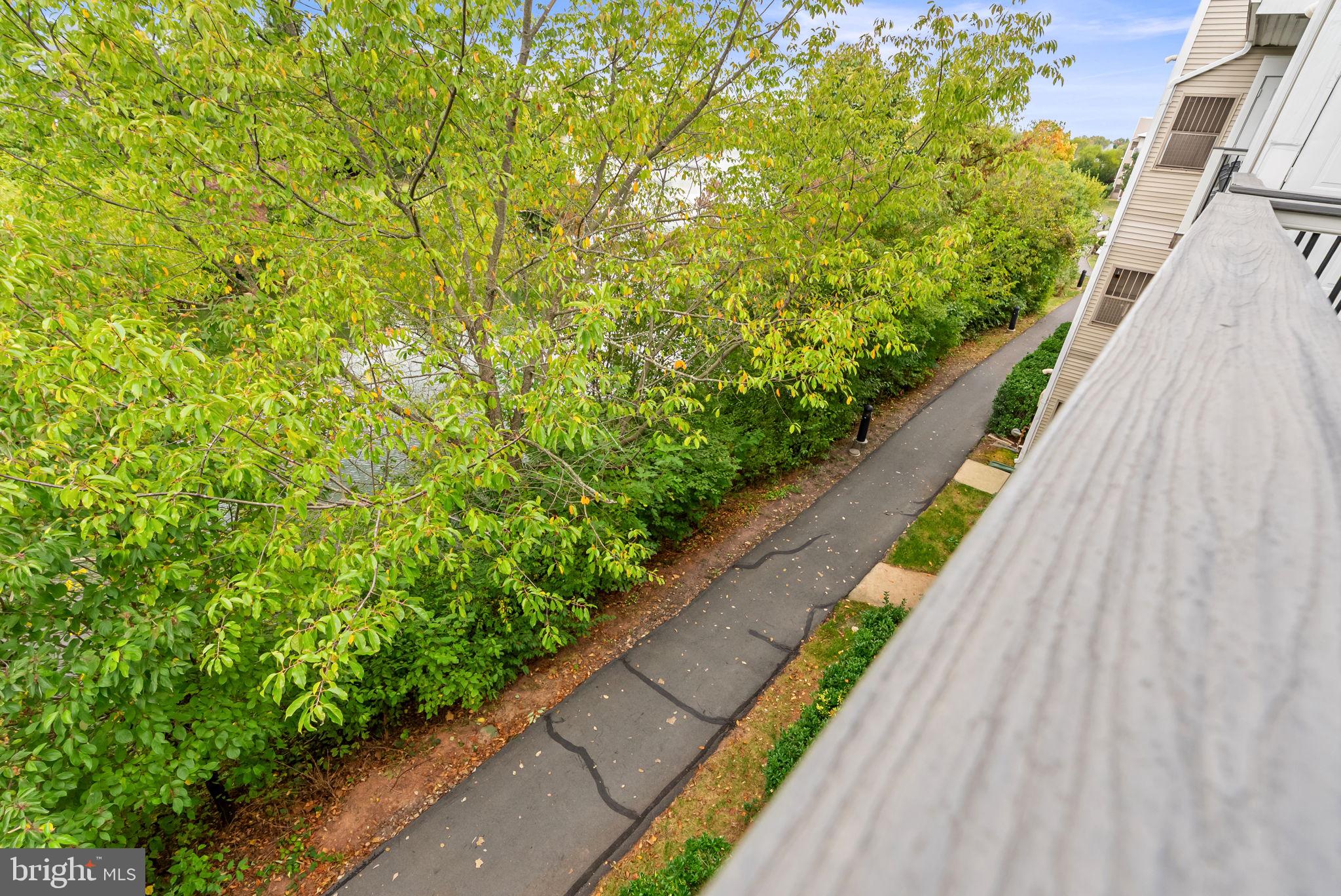 44084 Natalie Terrace, Unit 301 Ashburn, VA 20147 - Photo 51 of 59 a view of a garden with wooden stairs