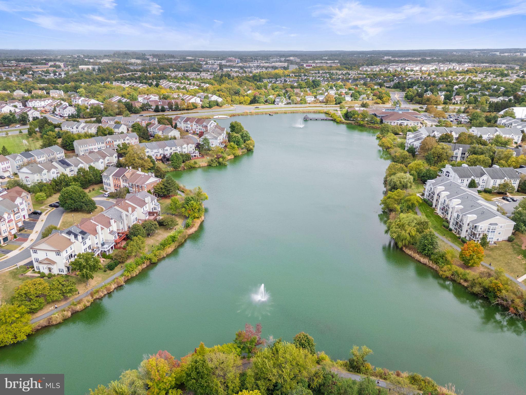 44084 Natalie Terrace, Unit 301 Ashburn, VA 20147 - Photo 53 of 59 an aerial view of residential houses with outdoor space and lake view