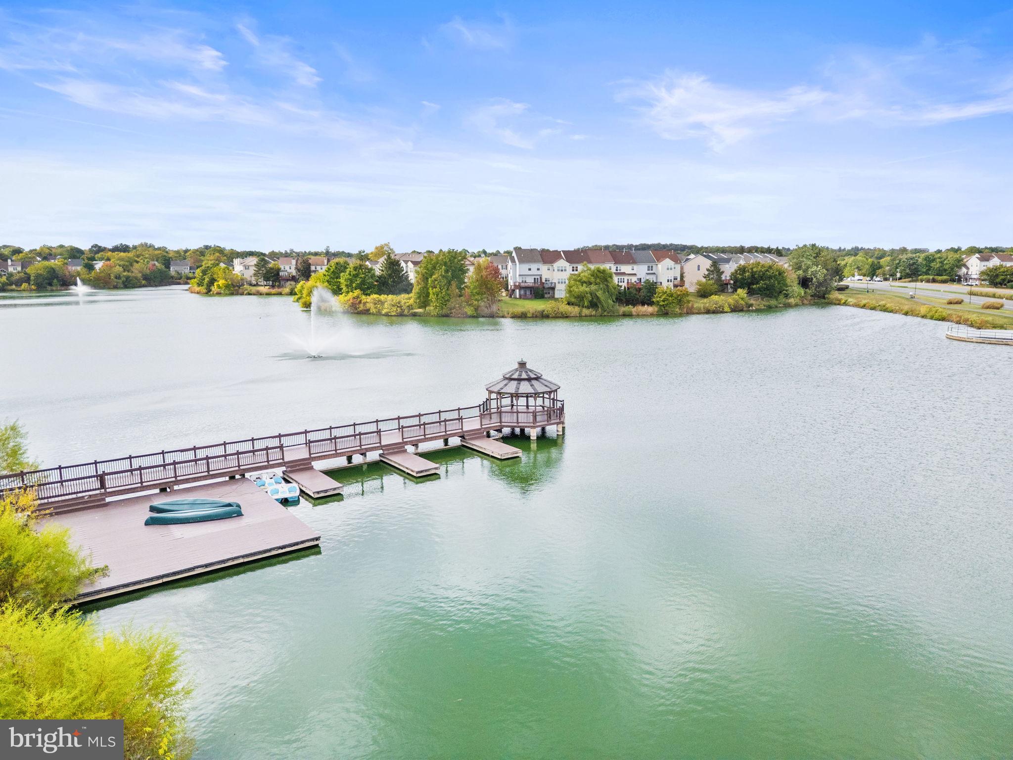 44084 Natalie Terrace, Unit 301 Ashburn, VA 20147 - Photo 55 of 59 a view of a lake with a city