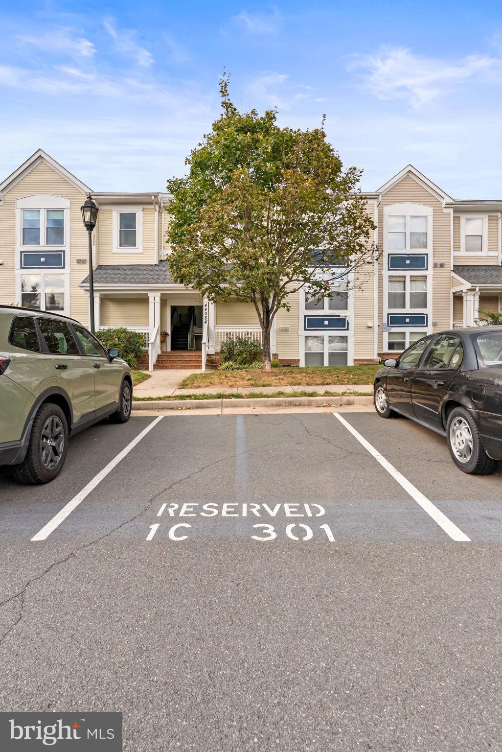 44084 Natalie Terrace, Unit 301 Ashburn, VA 20147 - Photo 6 of 59 a view of a car parked in front of a house