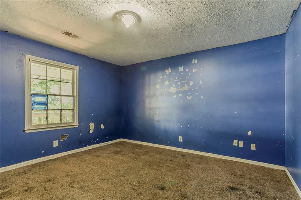 926 Bell Road Southeast Conyers, GA 30094 - Photo 11 of 30 an empty room with windows