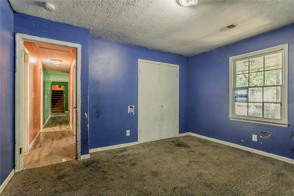 926 Bell Road Southeast Conyers, GA 30094 - Photo 12 of 30 an empty room with windows