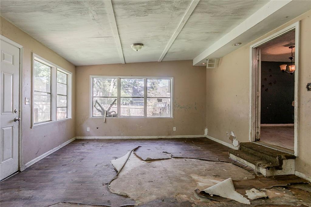 926 Bell Road Southeast Conyers, GA 30094 - Photo 13 of 30 a room with gym equipment and windows