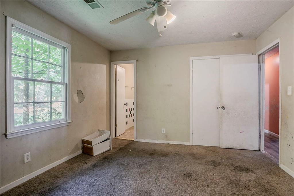 926 Bell Road Southeast Conyers, GA 30094 - Photo 16 of 32 an empty room with windows