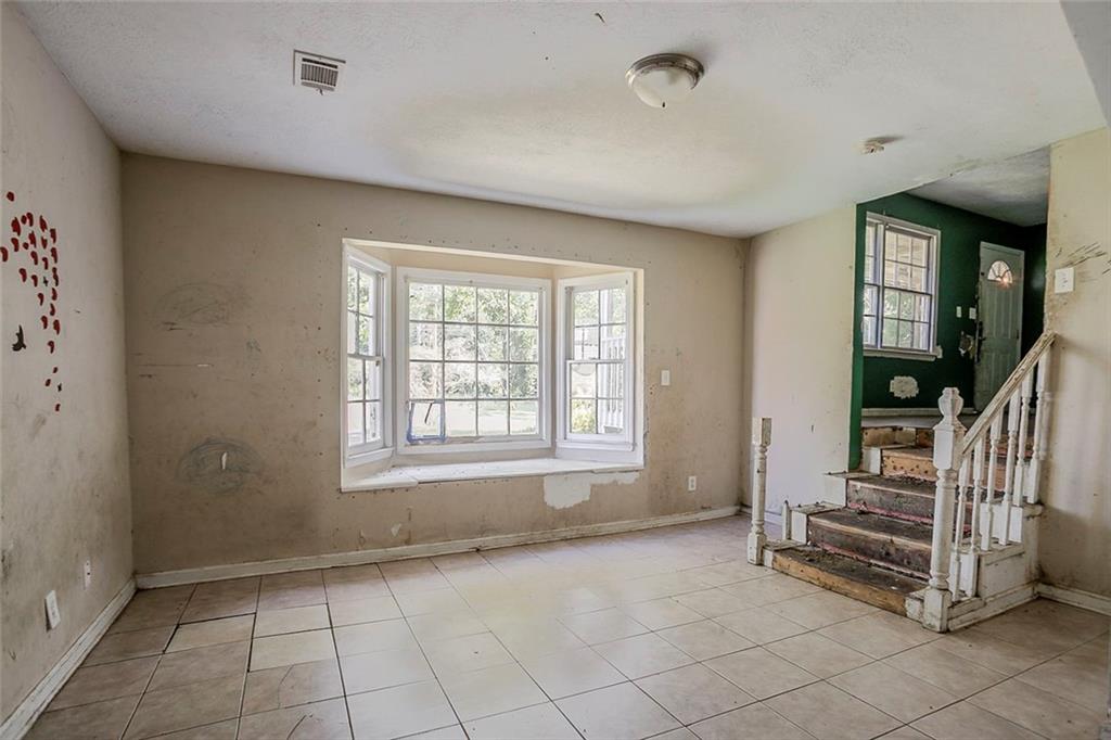 926 Bell Road Southeast Conyers, GA 30094 - Photo 19 of 32 an empty room with windows