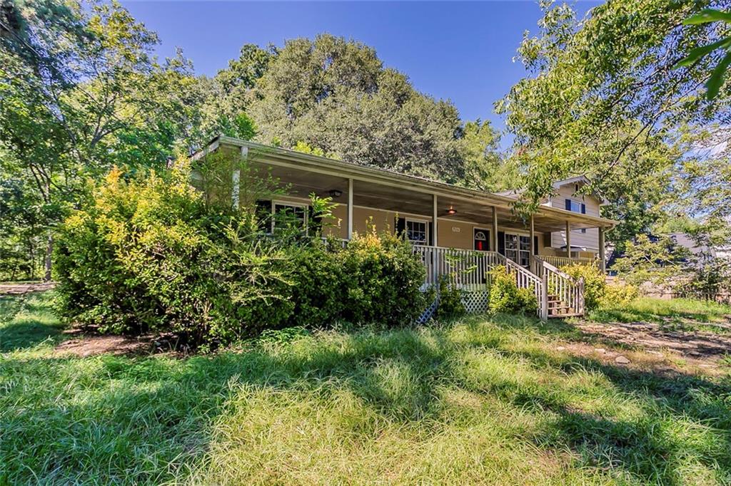 926 Bell Road Southeast Conyers, GA 30094 - Photo 2 of 32 a view of house with a yard