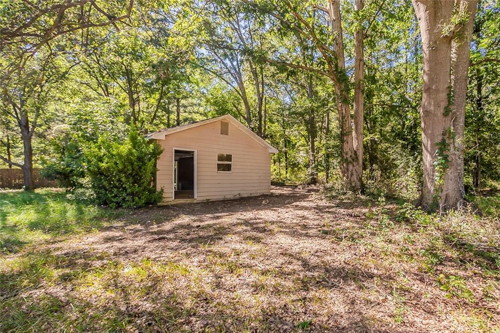 926 Bell Road Southeast Conyers, GA 30094 - Photo 24 of 30 a view of a house with large trees