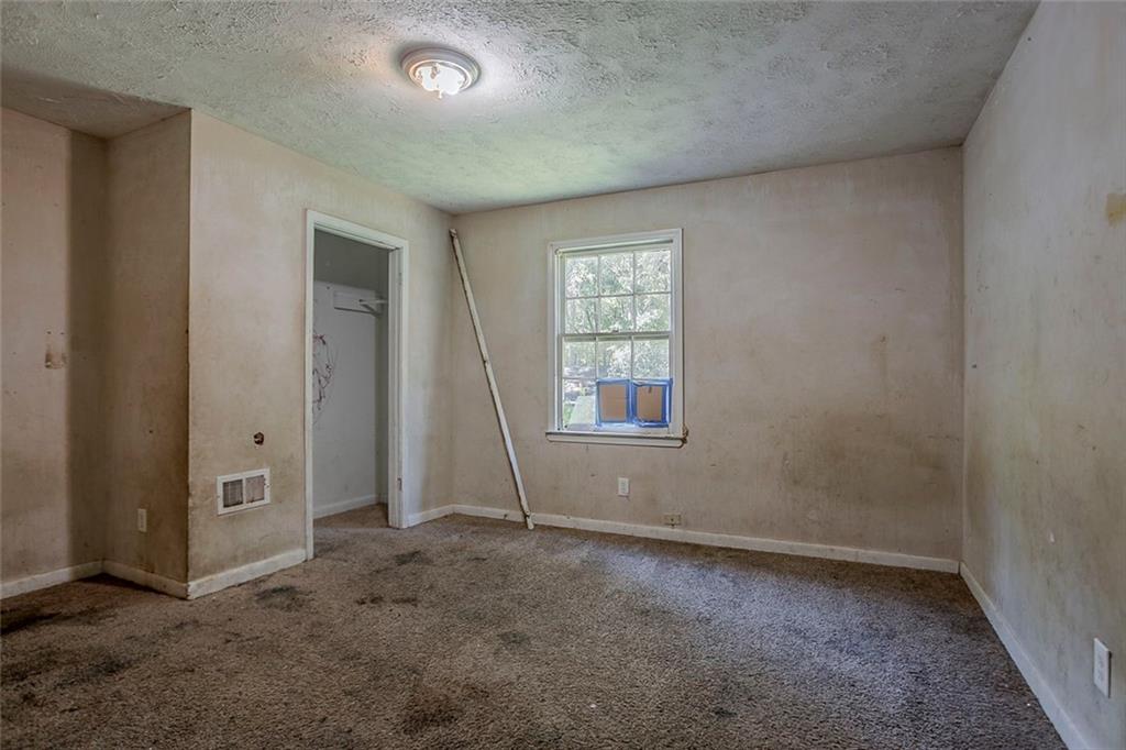 926 Bell Road Southeast Conyers, GA 30094 - Photo 24 of 32 an empty room with windows